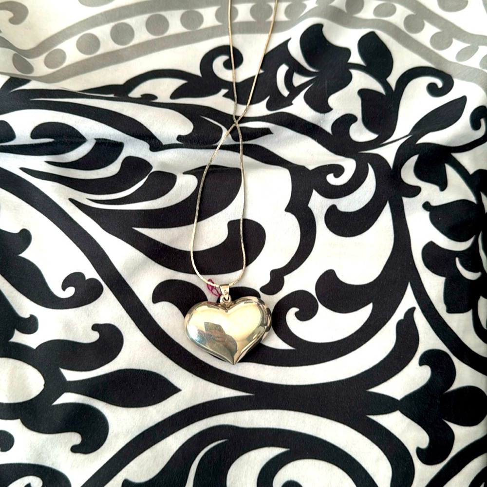 Sterling Silver hollow Heart Pendant (Silver toned chain included at no charge)